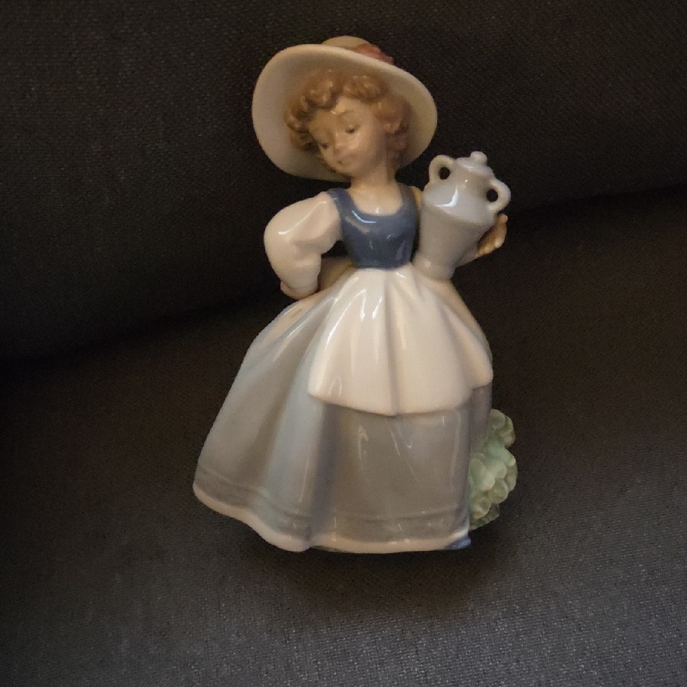 Charming Porcelain Figurine with Blue and White Dress " NAO "